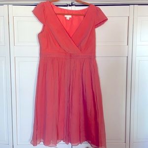 100% silk dress in a beautiful peachy color. Perfect to attend wedding or event